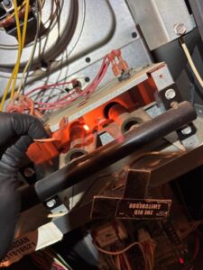 Burner flame inspection during heating service