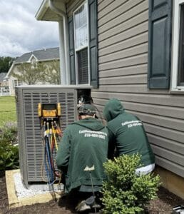 Hvac technicians preparing for ac repair service