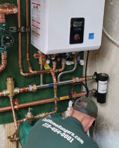 Wall-mounted tankless system with nearby piping