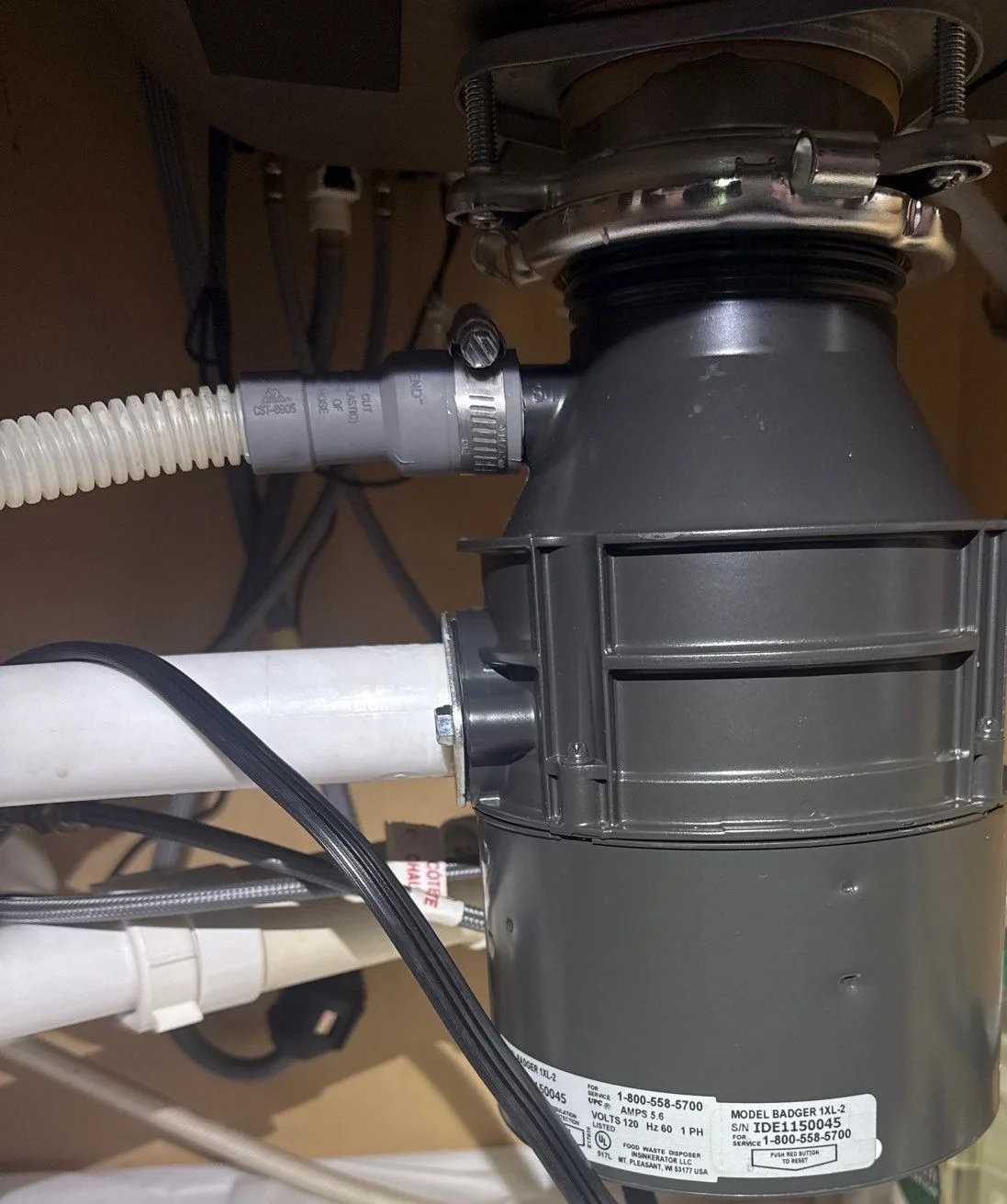 Home rangers technician performing kitchen drain cleaning service