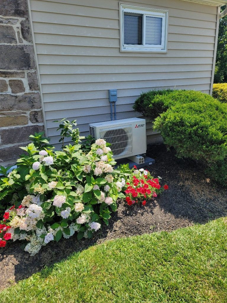 Home rangers ductless mini-split installation photo showing a mitsubishi outdoor unit beside a bucks county home