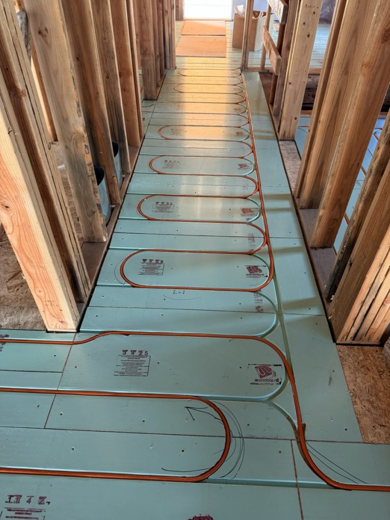 Home rangers radiant floor heating photo showing warmboard panels with pex tubing installed for hydronic radiant heat