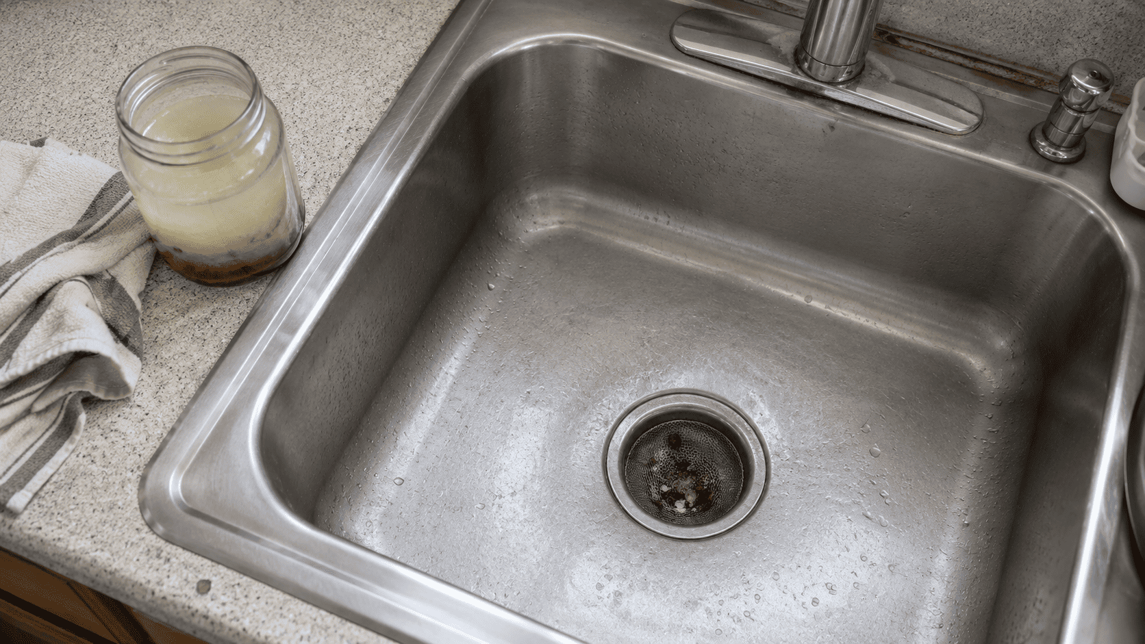 Mesh sink strainer catching food scraps as a simple way to prevent drain clogs